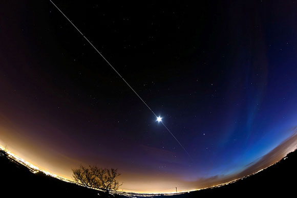 A composite photograph of the International Space Station from Earth. Image Credit: Dave Walker.