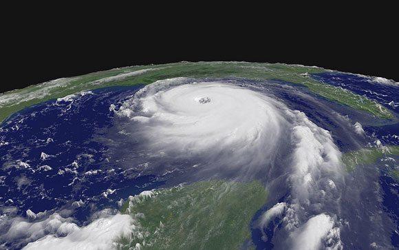 Oblique orbital view of large round white hurricane with distinct spirals and eye.
