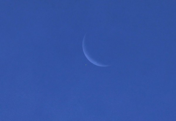 Lyle Evans in Highland, California caught Venus and the moon minutes before the occultation.  Thanks, Lyle!