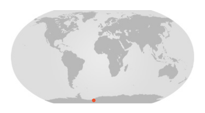 Map of whole world with red dot on the edge of Antarctica.