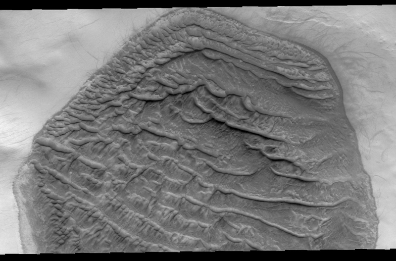 Hexagonal dune field on Mars with parallel stripes (dunes) running from upper left to lower right.