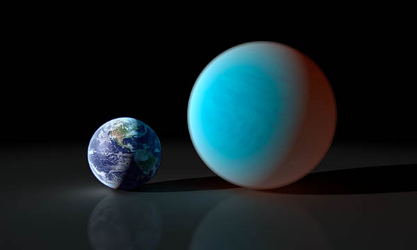 Smaller Earth next to blue planet over twice Earth's diameter.