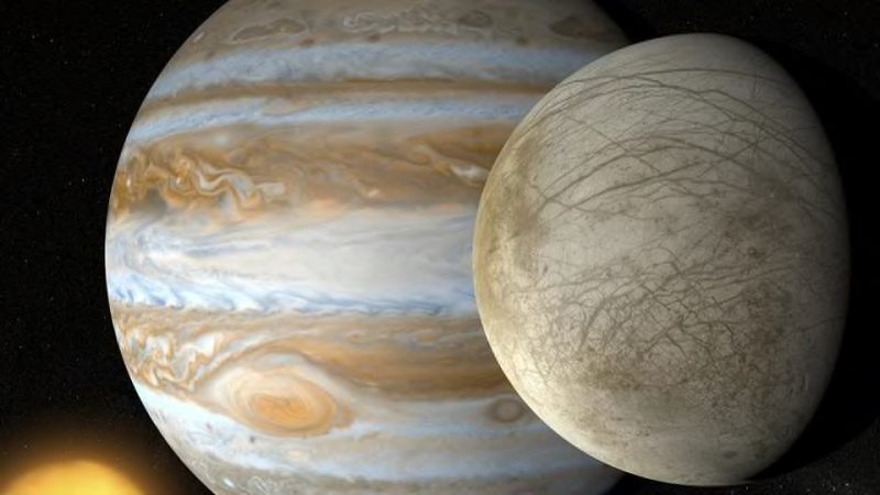 Jupiter in background, Europa in foreground.