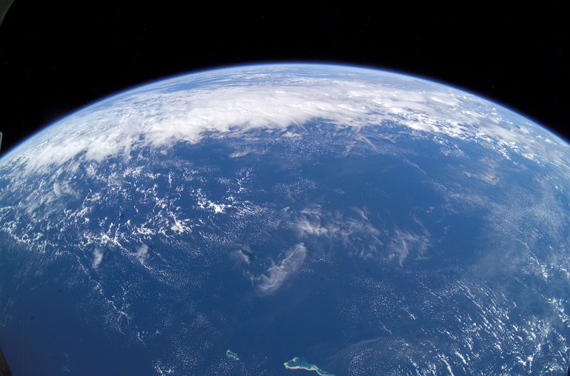 Earth's oceans from space with clouds.