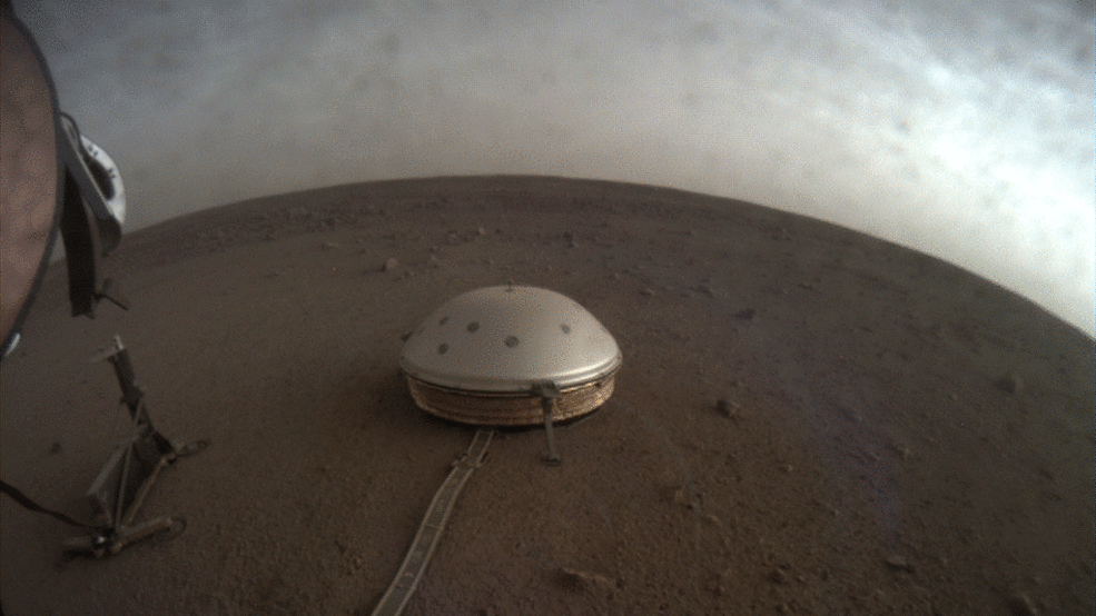 The clouds pass in the panorama showing part of the lander and the Masquake detector.