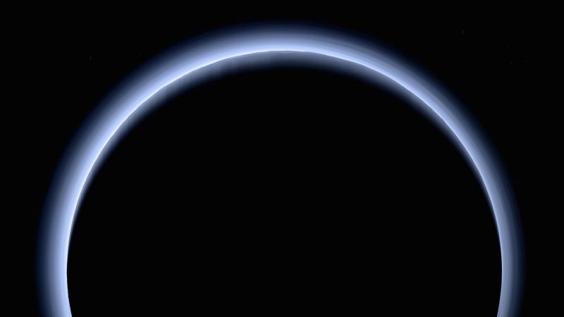 Black circle with edge of light blue fading to dark blue against black space.