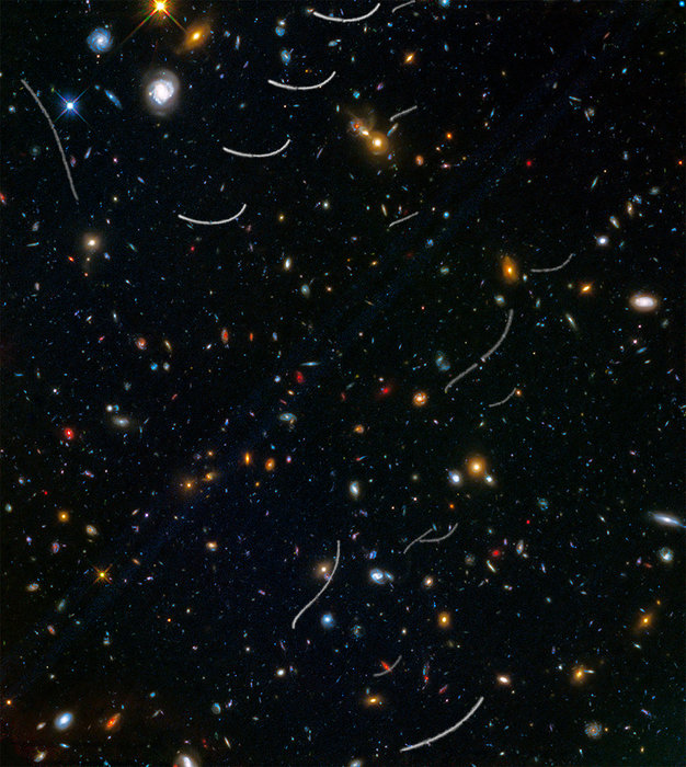 Colorful galaxy clusters and asteroid trails.