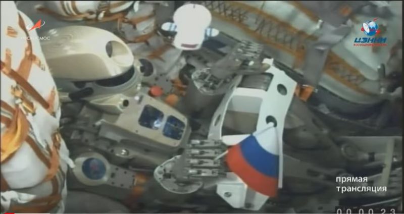 Skybot is seen sitting in the commander's seat of the Soyuz MS-14 spacecraft